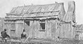 Hut with timber slab walls and a bark roof, Belle Vue Station, Glencoe