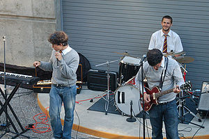 Photograph of a group playing instruments in an amphitheater.