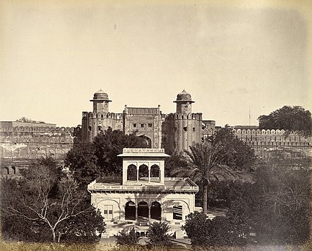 A picture showing the Lahore Fort (Alamgiri Gate in background) and Hazuri Bagh Pavilion (foreground) in 1870.