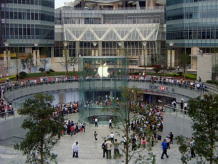 Apple customers wait in line around an Apple Store in Shanghai in anticipation of a new product.