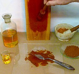 Linseed oil and paint pigments mixing together to form oil paint Linseed oil paint..JPG