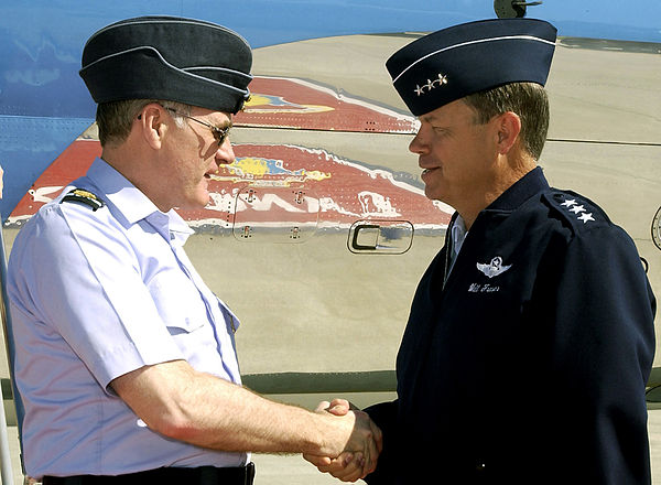 Senior Royal Air Force and United States Air Force officers wearing flight caps