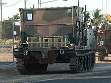 Colour photo of a tracked military vehicle
