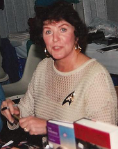 Reviewers praised the performance of Majel Barrett in "Half a Life". Majel Barrett in 2006 cropped.png