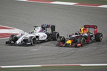Daniil Kvyat (right) finished ahead of Felipe Massa in seventh place. Massa Kvyat Bahrain 2016.jpg