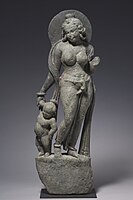 Mother Goddess from entrance of a Hindu Temple, Tanesara-Mahadeva (near Udaipur), suggesting connections with the Art of Gandhara.[71] 5th-6th[72][71] or early 7th century CE.[73]