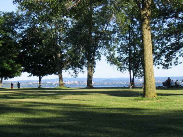 Onondaga Lake Park in the northern suburbs of Syracuse. Picture captures Onondaga Lake with the Syracuse skyline in the background. Onondaga Lake Park