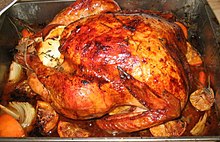 Roast dinner, often centered on turkey, is commonly consumed in English speaking countries. Oven roasted brine-soaked turkey.jpg