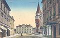 An old postcard of the railway station in front, Celje Hall on the right, and the Iron Court (Železni dvor, Eisenhof) on the far left