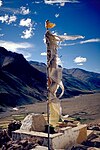 Prayer flag above the monastery of Tanze (the wind is believed to propagate the prayers printed on tissue)