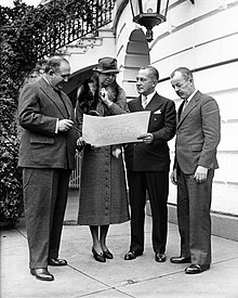 Edward Bruce, Eleanor Roosevelt, Assistant Secretary of the Treasury L. W. Robert Jr., and Forbes Watson look at a map of PWAP's 16 regional districts after the project was announced in December 1933. Public Works of Art Project Leaders.jpg