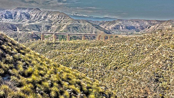 The Anchurón bridge in southern Spain was used for exteriors in the bomb-damaged bridge scenes. Studio sets and models were used for close ups. The re