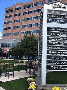 The main Quincy College building, within the Presidents Place complex in downtown Quincy Quincy College building and Galleria sign.jpg