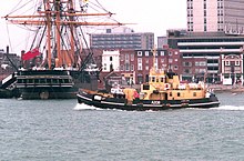 Clovelly-class Lamlash passing HMS Warrior at Portsmouth April 30, 2000 RMAS Lamlash and HMS Warrior.jpg
