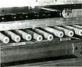 Each of the 12 wheels accompanying each pocket can be shifted laterally on the rod into one of two positions, giving a total of 2^23 or 4096 combinations. As the conveyor moves, each set of 12 wheels rolls over tracks designed so that when the correct destination is reached, all of the wheels drop into depressions and the letter is released. In 1957 Jacob Rabinowâ€™s company, Rabinow Engineering, designed a mechanical coding and sorting system for the U.S. Post Office. Based on similar work Rabinow had done previously for the Census Bureau, the system for the Post Office consisted of a conveyor belt cart designed to carry 12 envelopes in separate compartments. Each compartment in the cart was accompanied by an escort memory. The escort memory consisted of a shaft carrying a series of nylon code wheels. Each of the 134 wheels could move laterally into one of two positions. With this combination, more than 8000 (in decimal notation) binary numbers could be set. Twelve keyboard operators would read envelope addresses and set the positions of the code wheels. The wheels were supported on a track also composed of binary elements. When the encoded compartment hit the same encoded position on the track, the shaft dropped, triggering a door release in the compartment holding the envelope. The envelope then fell into the appropriate pocket. About 600 of the letter sorting machines were built and used by the Post Office. In later operations optical character recognition technology replaced the keyboard operators, and the mechanical escort memory was replaced by computer memory. Reference: Inventing for Fun and Profit. Jacob Rabinow. San Francisco Press, San Francisco, CA. (1990). pp. 100-138.