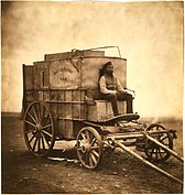 Marcus Sparling seated on Fenton's photographic van, Krimea, 1855.