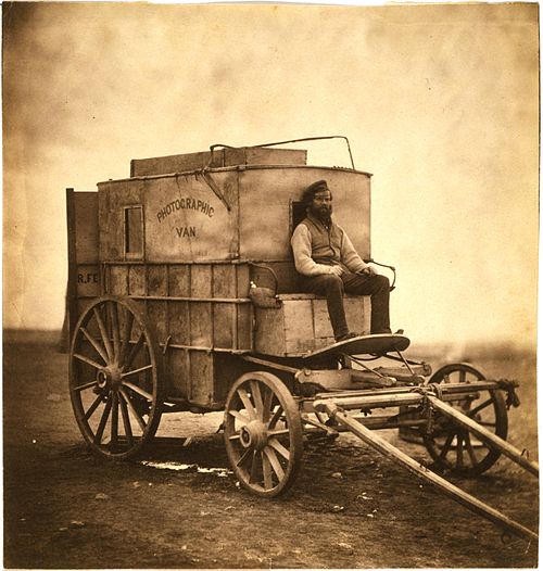 Marcus Sparling seated on Fenton's photographic van, Crimea, 1855.