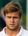 Ryan Harrison competing in the first round of the 2015 Wimbledon Qualifying Tournament at the Bank of England Sports Grounds in Roehampton, England. The winners of three rounds of competition qualify for the main draw of Wimbledon the following week.