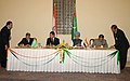 S.M. Krishna and the Deputy PM of Turkmenistan, Mr. Khydyr Saparliyev signing the agreement to enhance cooperation in the field of education between India and Turkmenistan, in the presence of the President of Turkmenistan.jpg