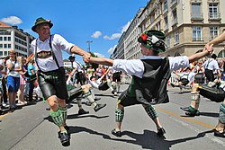 Participants at the 2016 Munich Pride parade dancing the traditional Bavarian Schuhplattler Schwuhplattler CSD 2016.jpg