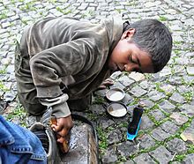 A boy shoeshiner in Gondar, Ethiopia. Shoe Shine Boy, Ethiopia (8198535107).jpg