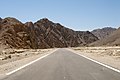 Sinai, Egypt, Road through the desert landscape, rocky peaks and valleys.jpg