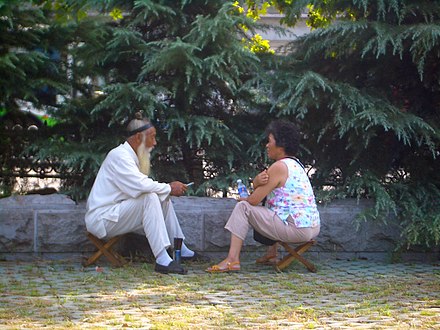 A fortune-telling Taoist priest with a customer outside of Changchun Temple, Wuhan