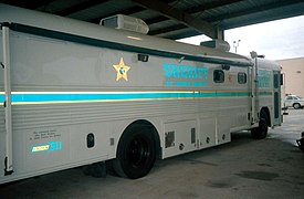 St. John's County (FL) Command Center bus (1980s Blue Bird All American), curbside view