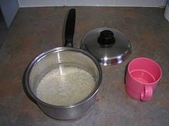 3. Pour water into saucepan. Remember—twice as much water as rice.