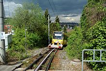 Rack Railway going northwards between Pfaffenweg and Liststrasse stations, with wagon to transport bicycles Stuttgart Zahnradbahn Pfaffenweg.jpg