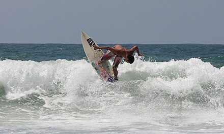 A surfer performing a manoeuver with the tip of the board up, in Punta Carnero Ecuador, South America. Surfer punta carnero ecuador south america.jpg