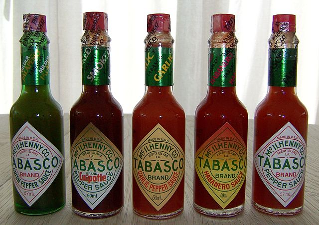 A few of the varieties of Tabasco sauce, with the original on the far right.