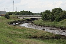 the Old-River-Tees Authority border bridge crossing from shopping park (Borough of Stockton-on-Tees) to leisure park (Middlesbrough) The Old River Tees - geograph.org.uk - 475628.jpg