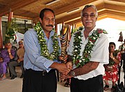 Talagi with his eventual successor Dalton Tagelagi in May 2010 The Premier of Niue,Hon. Toke Talag hands over the Queen's Baton Delhi 2010 to the Associate Minister Of Sports Hon. Dalton Tagelagi,in Niue on May 12,2010.jpg