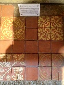 Original floor tiles from the tower with the Marguerite flower