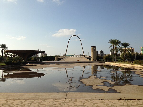 The helicopter landing apron (left) and the gateway arch to the open-air theatre at the Rashid Karami International Fair