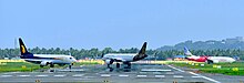 (From Left) Jet Airways, Vistara and Air India Express flights near the runway getting ready for Takeoff Trivandrum International Airport Aircrafts in Runway.jpg