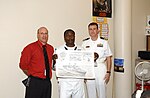 Thumbnail for File:US Navy 070510-N-0318S-007 James O'Tremba, principal of Columbia Middle School, stands with Ship's Serviceman 1st Class Kelvin Birdine and Lt Cmdr. Jeff Oakey from the Precommsssioning Unit (PCU) Mesa Verde (LPD 19).jpg