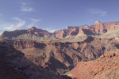 Bass Formation sitting on Granite Gorge.
Isis Temple-Cheops Pyramid region (Utah Flats), with Shinumo Quartzite cliffs above orange-red Hakatai Shale, upon Bass Formation. Utah Flats.jpg