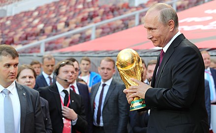 President Vladimir Putin holding the FIFA World Cup Trophy at a pre-tournament ceremony in Moscow on 9 September 2017