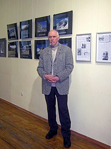 Pinchuk in front of his photographs.