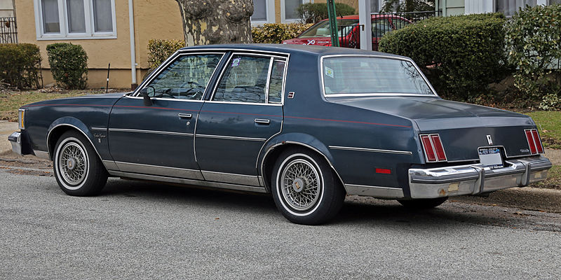 File:1986 Oldsmobile Cutlass Supreme Brougham sedan, rear left.jpg