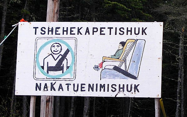 "Buckle up your children" sign in Innu-aimun language, in the Pointe-Parent reserve near Natasquan, Quebec.