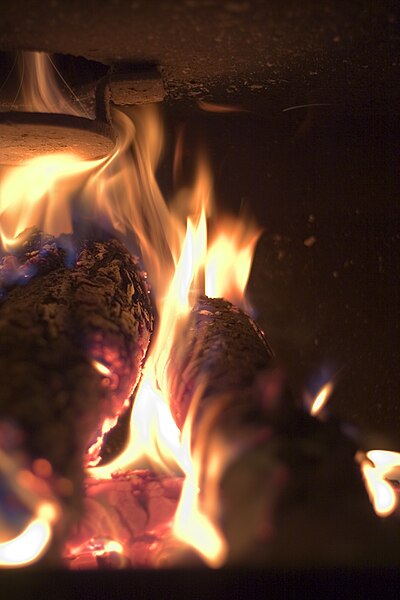 File:A fire in an iron fireplace.jpg