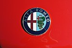 Alfa Romeo Badge on Red Background.jpg