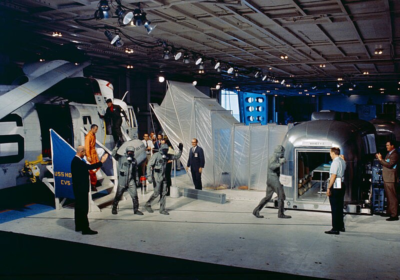 File:Apollo 11 astronauts followed by Dr. Carpentier walk from the recovery helicopter to the MQF in Hornet’s hangar bay.jpg