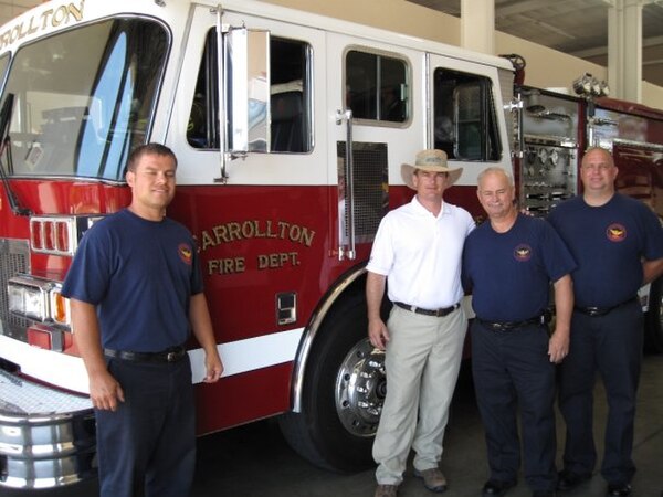 Austin Scott meets with members of the Carrollton, GA fire department on July 20, 2009, during the Walk of Georgia.