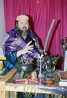 Baba Raul Canizares, a Cuban priest of both Santeria and Palo; here he is photographed with his ritual paraphernalia, including a nganga cauldron. Baba Raul Canizares.jpg