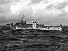 23 January 1960: Trieste just before the record dive. USS Lewis is in the background. Bathyscaphe Trieste with USS Lewis (DE-535) over the Marianas Trench, 23 January 1960 (NH 96797).jpg