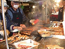 Vendors BBQ various meats at a Taiwan night market, Bbq taiwan.jpg